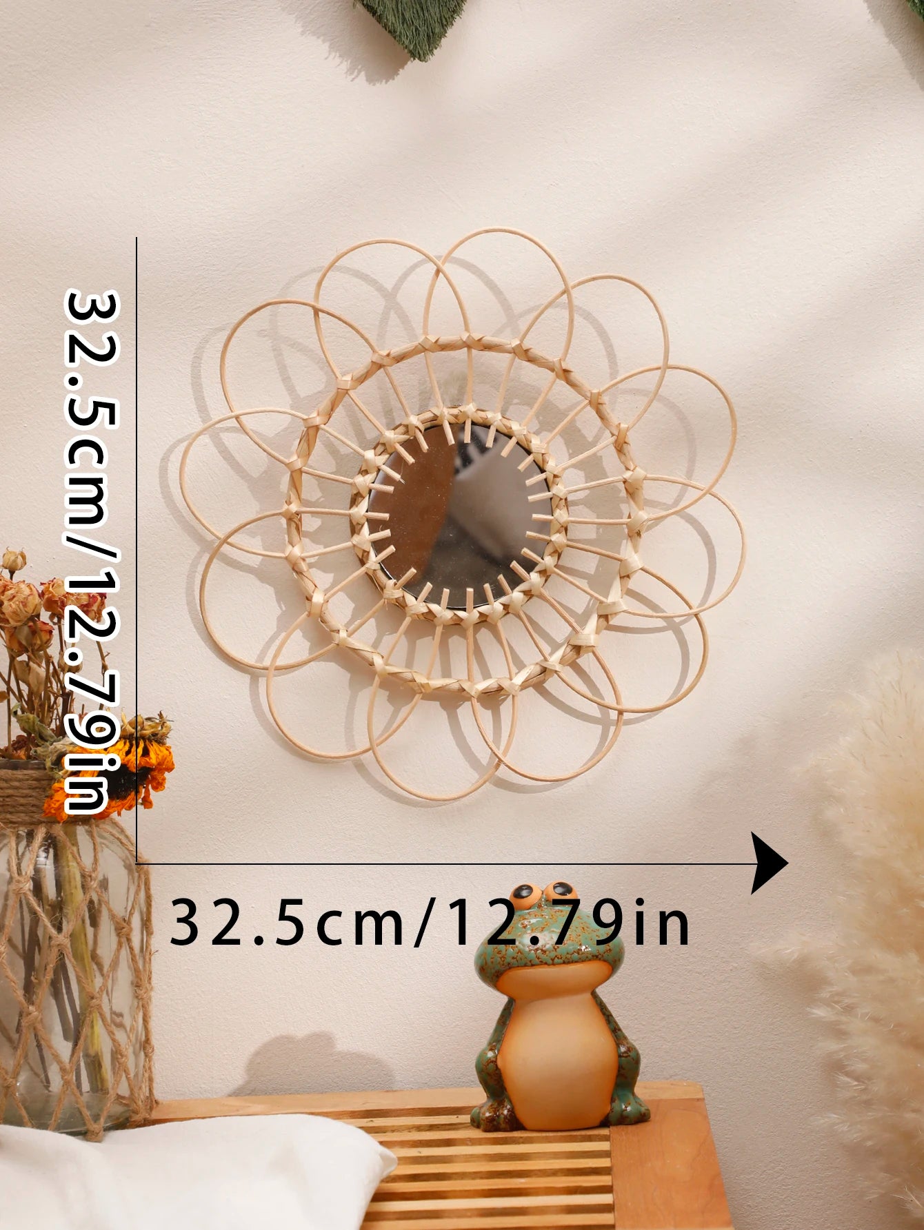 Dimension chart for boho rattan sunflower wall mirror showing 32.5cm/12.79in diameter, displayed on a cream wall with dried florals and pampas grass — LivDecor