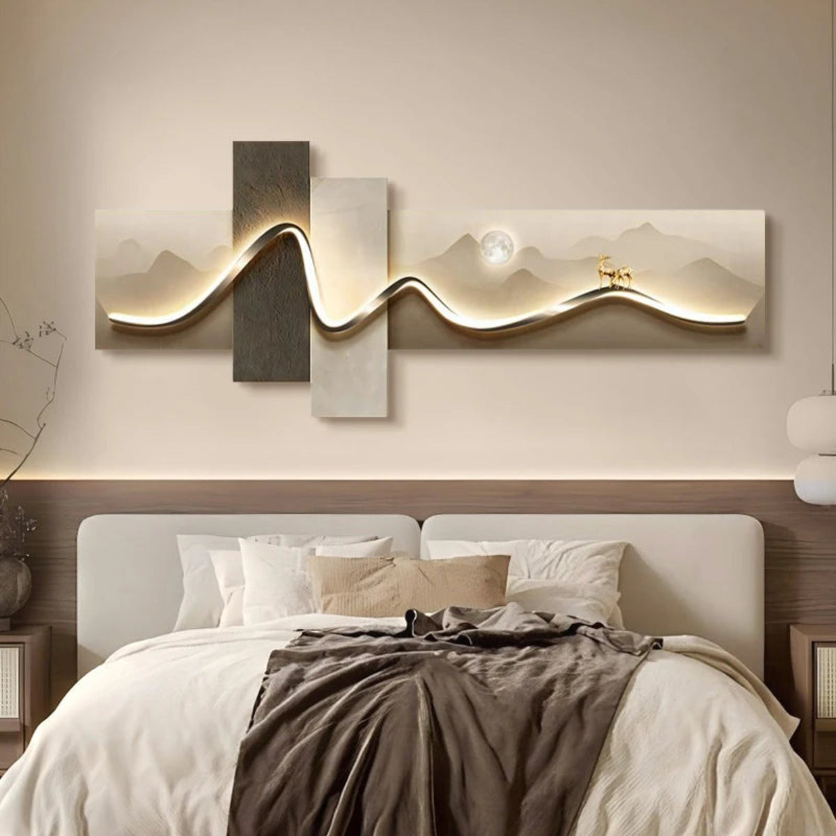 Geometric Wave LED wall art with mountain landscape moon and gold deer motif cross-panel canvas and sinuous LED light strip illuminated above a white upholstered bed with linen bedding and walnut nightstands — LivDecor
