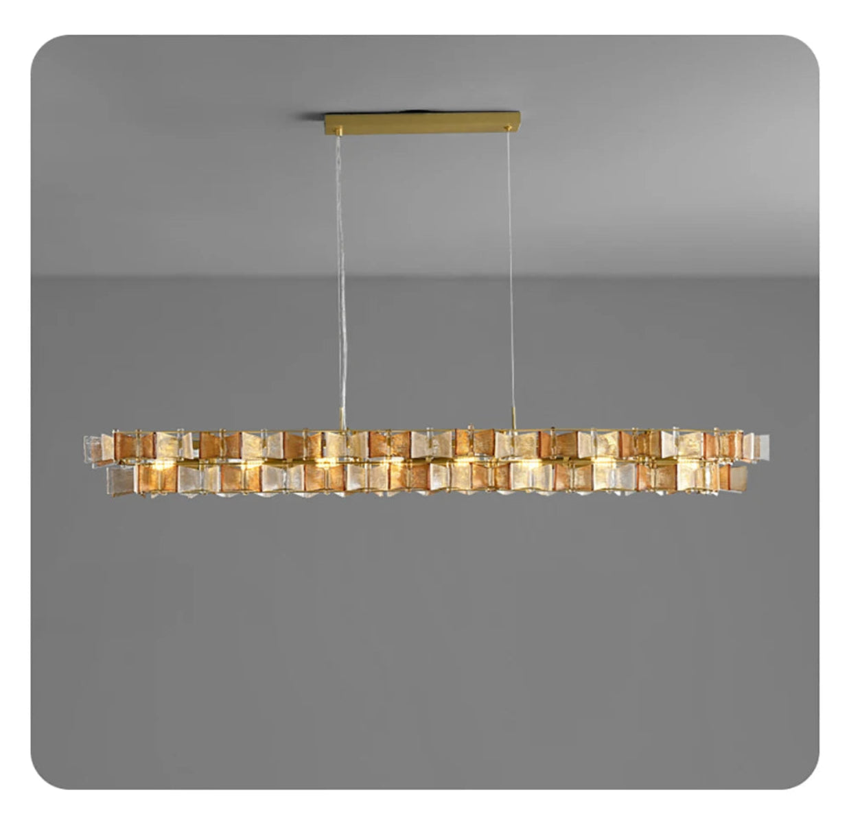 Amber and clear ribbed glass iron linear chandelier 150cm wide with gold rectangular ceiling mount and adjustable hanging cord displayed against a neutral grey background — LivDecor
