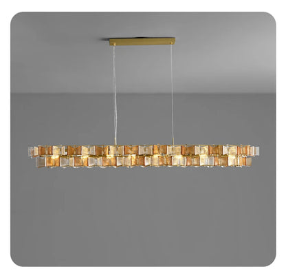 Amber and clear ribbed glass iron linear chandelier 150cm wide with gold rectangular ceiling mount and adjustable hanging cord displayed against a neutral grey background — LivDecor
