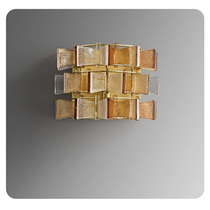 Amber and clear ribbed glass iron wall sconce in medium size with three-tier gold frame displayed against a neutral grey background — LivDecor