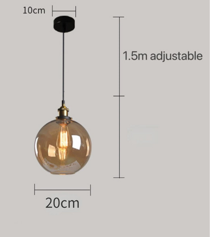 Amber glass globe pendant light with brass Edison bulb fitting and black cord, showing 20cm diameter with 1.5m adjustable cord on a grey background — LivDecor