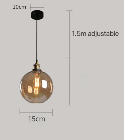 Amber glass globe pendant light with brass Edison bulb fitting and black cord, showing 15cm diameter with 1.5m adjustable cord on a grey background — LivDecor