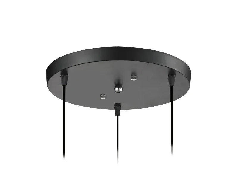 Matte black round ceiling canopy plate with three black cord outlets for multi-pendant light installation — LivDecor
