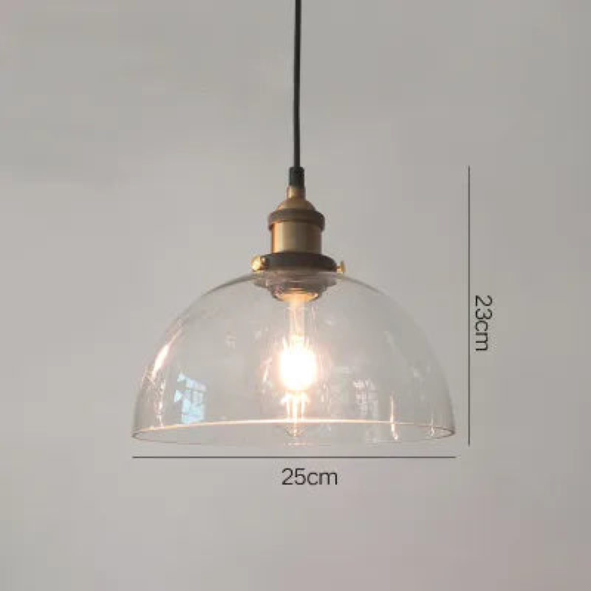 Single clear glass dome pendant light with antique brass socket and Edison filament bulb on black cord, 25cm diameter and 23cm height — LivDecor