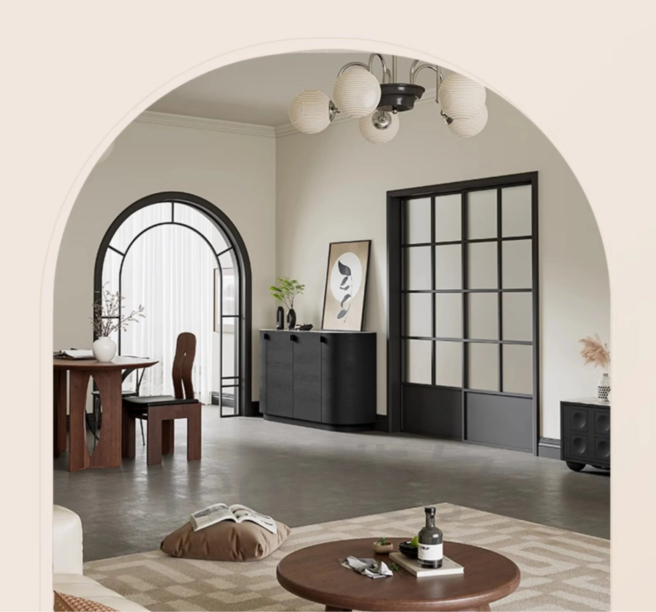 Aura Glass Wabi-Sabi display cabinet in black styled against a glass partition wall in a warm neutral living room with arched doorway and globe chandelier — LivDecor
