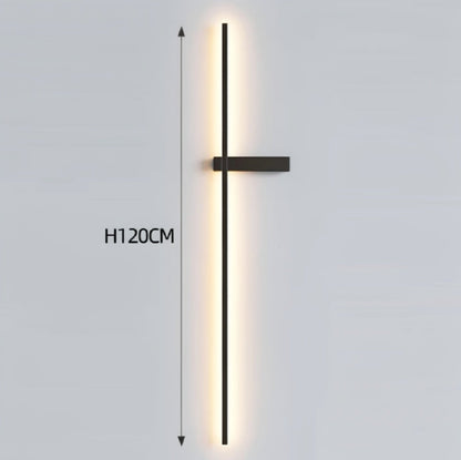 Black minimalist linear LED wall sconce emitting a warm glow, showing 120cm height on a grey background — LivDecor
