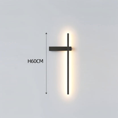 Black minimalist linear LED wall sconce with left-facing mounting arm emitting a warm glow, showing 60cm height on a grey background — LivDecor
