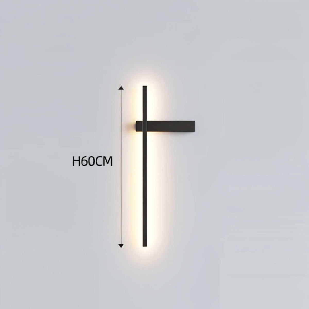 Black minimalist linear LED wall sconce with right-facing mounting arm emitting a warm glow, showing 60cm height on a grey background — LivDecor

