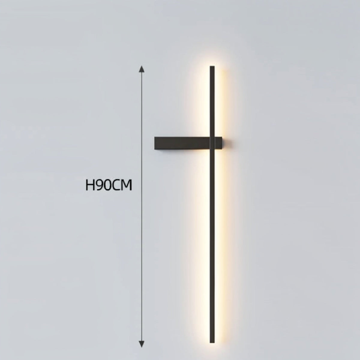 Black minimalist linear LED wall sconce with left-facing mounting arm emitting a warm glow, showing 90cm height on a grey background — LivDecor
