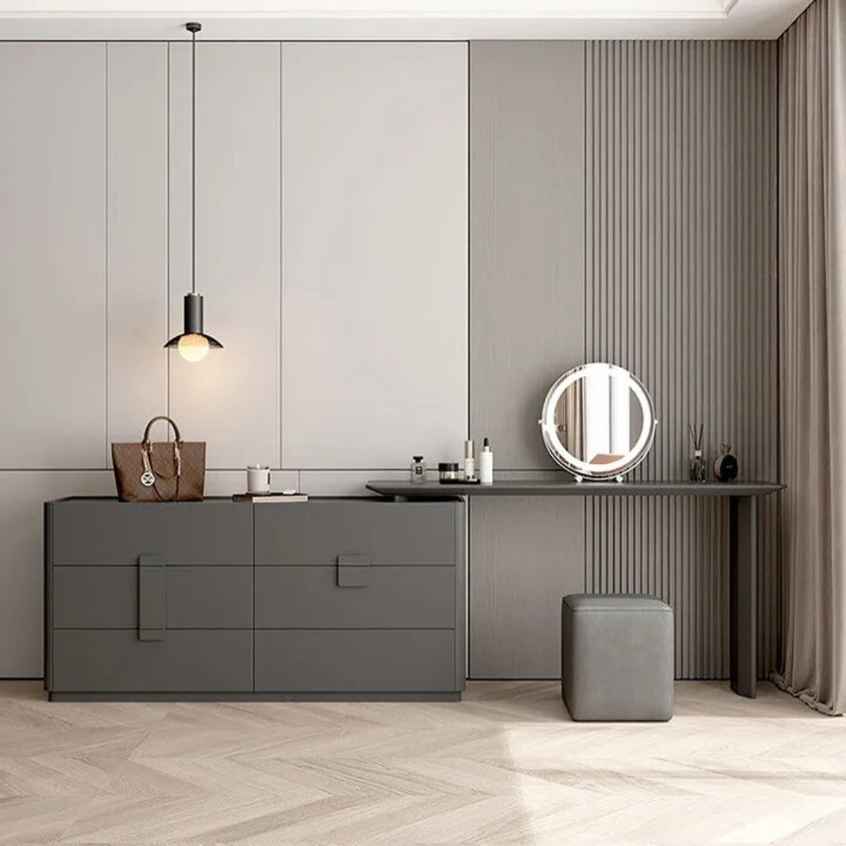 Aura Suite luxury vanity dresser set in dark grey with 6-drawer chest, integrated vanity desk, round LED mirror, and cube stool against a grey fluted panel wall with linen drapes in a minimalist bedroom — LivDecor