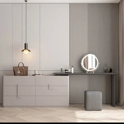 Aura Suite luxury vanity dresser set in light grey full-width centered view with 6-drawer chest, integrated vanity desk, round LED mirror, and cube stool in a minimalist grey bedroom — LivDecor
