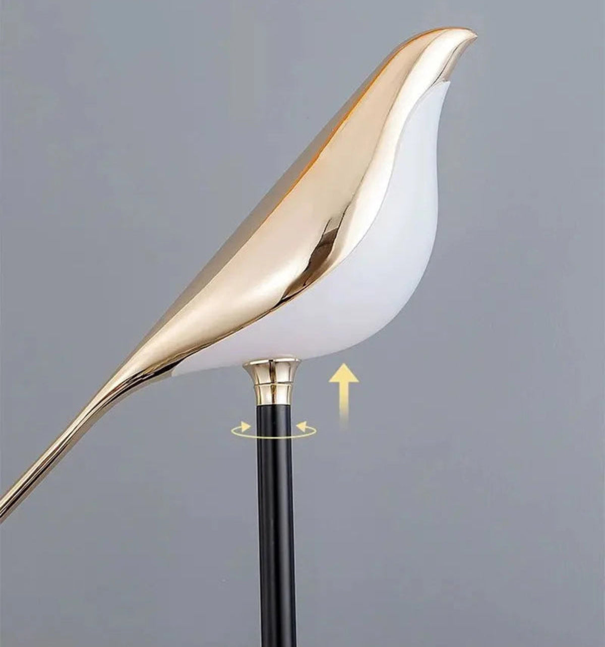 Avis Modern Origami Bird LED wall sconce close-up of gold bird body on matte black arm showing adjustable height and rotation mechanism with directional arrows — LivDecor
