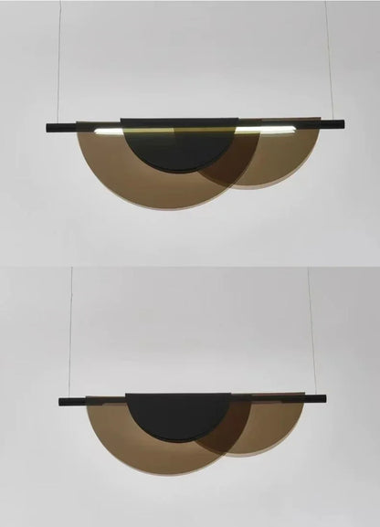 Black and bronze acrylic petal pendant light shown in two views — illuminated with warm LED glow and unlit — suspended against a grey wall, demonstrating the dual color LED light source — LivDecor