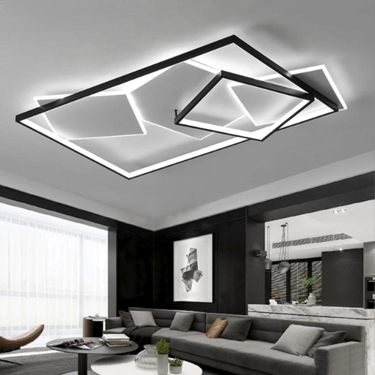 Black geometric multi-rectangle LED flush mount ceiling light illuminated above a dark open-plan living and dining room with grey sofas — LivDecor
