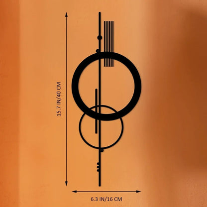 Dimension chart for black metal geometric abstract wall art featuring a double circle and vertical line design, measuring 40cm/15.7in tall by 16cm/6.3in wide, displayed on a warm terracotta background — LivDecor