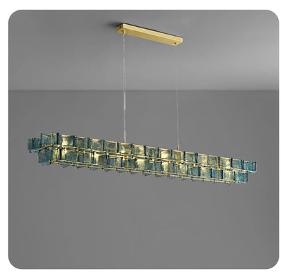 Blue ribbed glass iron linear chandelier 150cm wide with gold rectangular ceiling mount and adjustable hanging cord displayed against a neutral grey background — LivDecor
