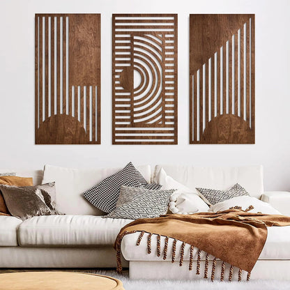 3-piece boho geometric laser-cut wooden wall art set in walnut finish displayed above a cream sectional sofa with caramel throw blanket and mixed boho cushions — LivDecor