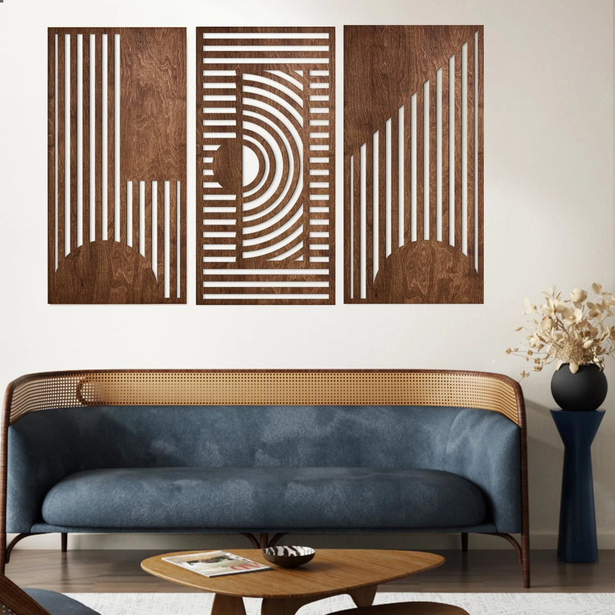 3-piece boho geometric laser-cut wooden wall art set in walnut finish displayed above a blue velvet cane-back sofa in a mid-century modern living room — LivDecor
