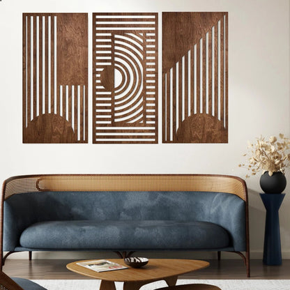 3-piece boho geometric laser-cut wooden wall art set in walnut finish displayed above a blue velvet cane-back sofa in a mid-century modern living room — LivDecor