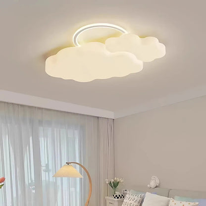 Cumulus Luxe cream sculptural double cloud LED ceiling light with halo ring glowing warm white in a soft neutral kids bedroom with sheer curtains, tulips, and a stuffed bunny — LivDecor
