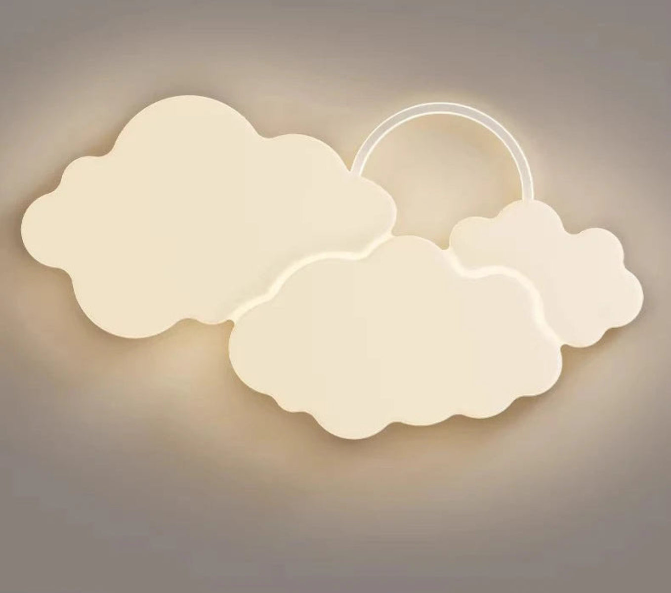 Cumulus Luxe cream sculptural double cloud LED ceiling light with halo ring glowing warm white against a neutral grey background, clean product shot — LivDecor
