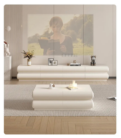 Cream ivory tubular floating TV stand centered in a modern living room with a matching coffee table, dried florals, framed art, and projector screen lifestyle shot — LivDecor
