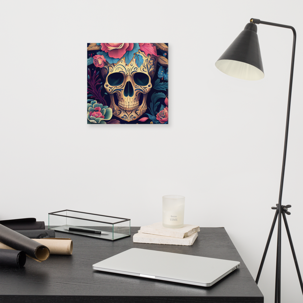 Flor de Noche sugar skull canvas print in 12×12 hung above a dark wood home office desk with a laptop, glass tray, stacked books, candle, and black tripod floor lamp — LivDecor
