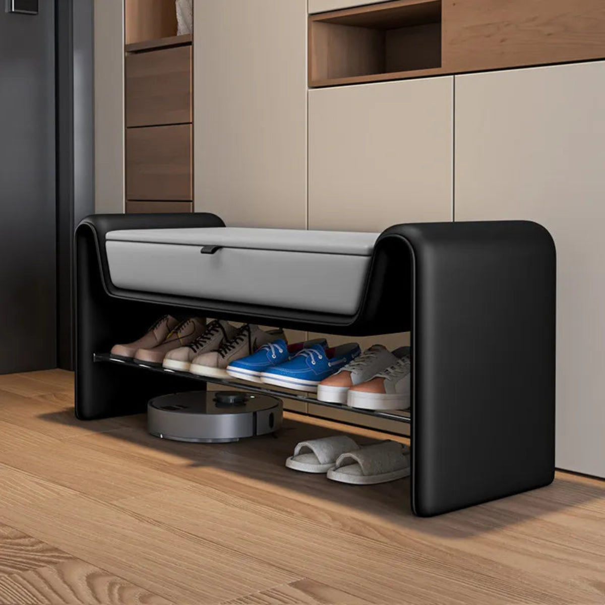 Folio Luxe entryway shoe storage bench in black faux leather with grey lift-top seat shown at a three-quarter angle with shoes on the lower rack in a modern entryway — LivDecor
