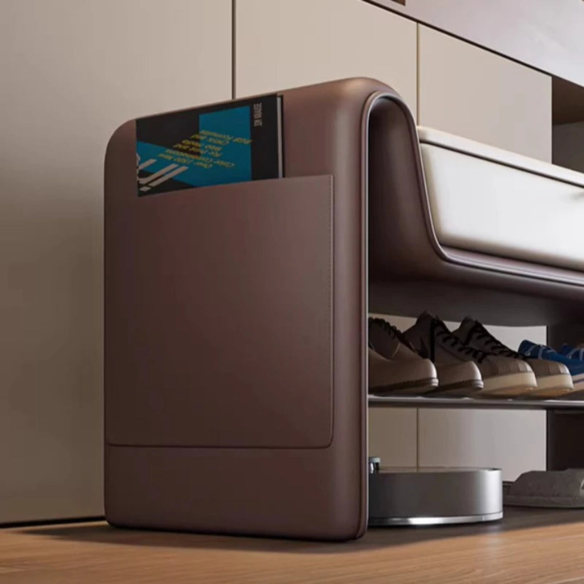 Close-up of the Folio Luxe entryway shoe storage bench brown faux leather side panel with built-in storage pocket holding a tablet — LivDecor
