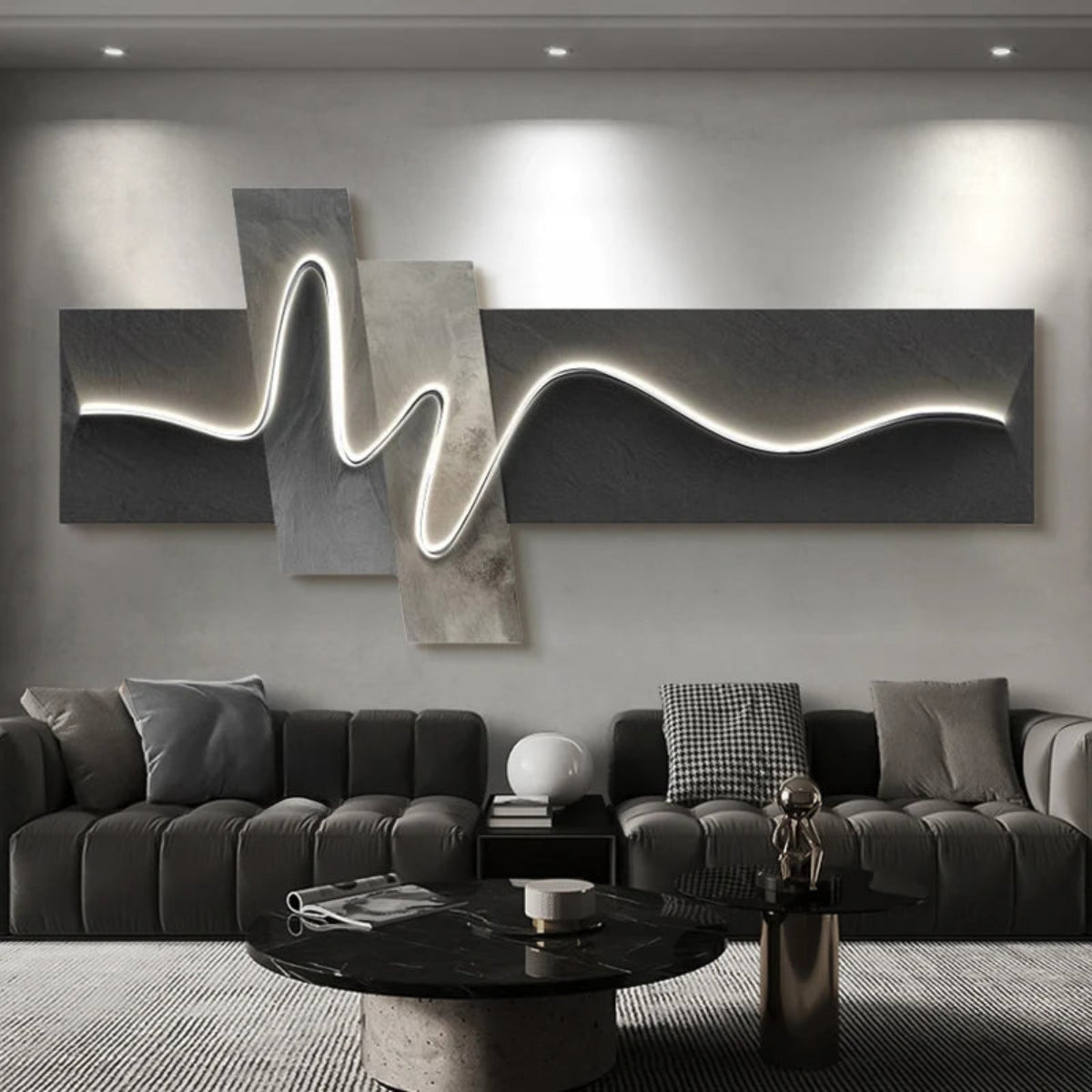 Geometric Wave LED wall art with charcoal and marble-effect diagonal cross-panel canvas and double-peak sinuous LED light strip illuminated above a charcoal modular sectional sofa with black marble coffee table — LivDecor
