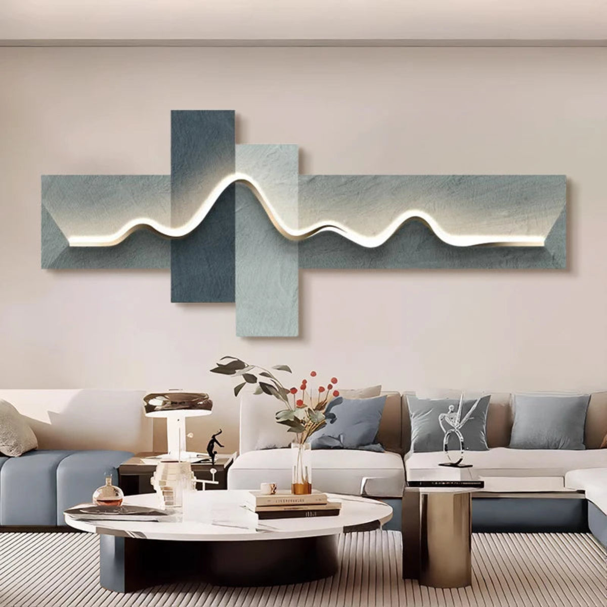Geometric Wave LED wall art with slate blue and pale sage cross-panel canvas and cool white LED light strip illuminated above a light grey modular sofa with blue and grey cushions and white marble round coffee table — LivDecor
