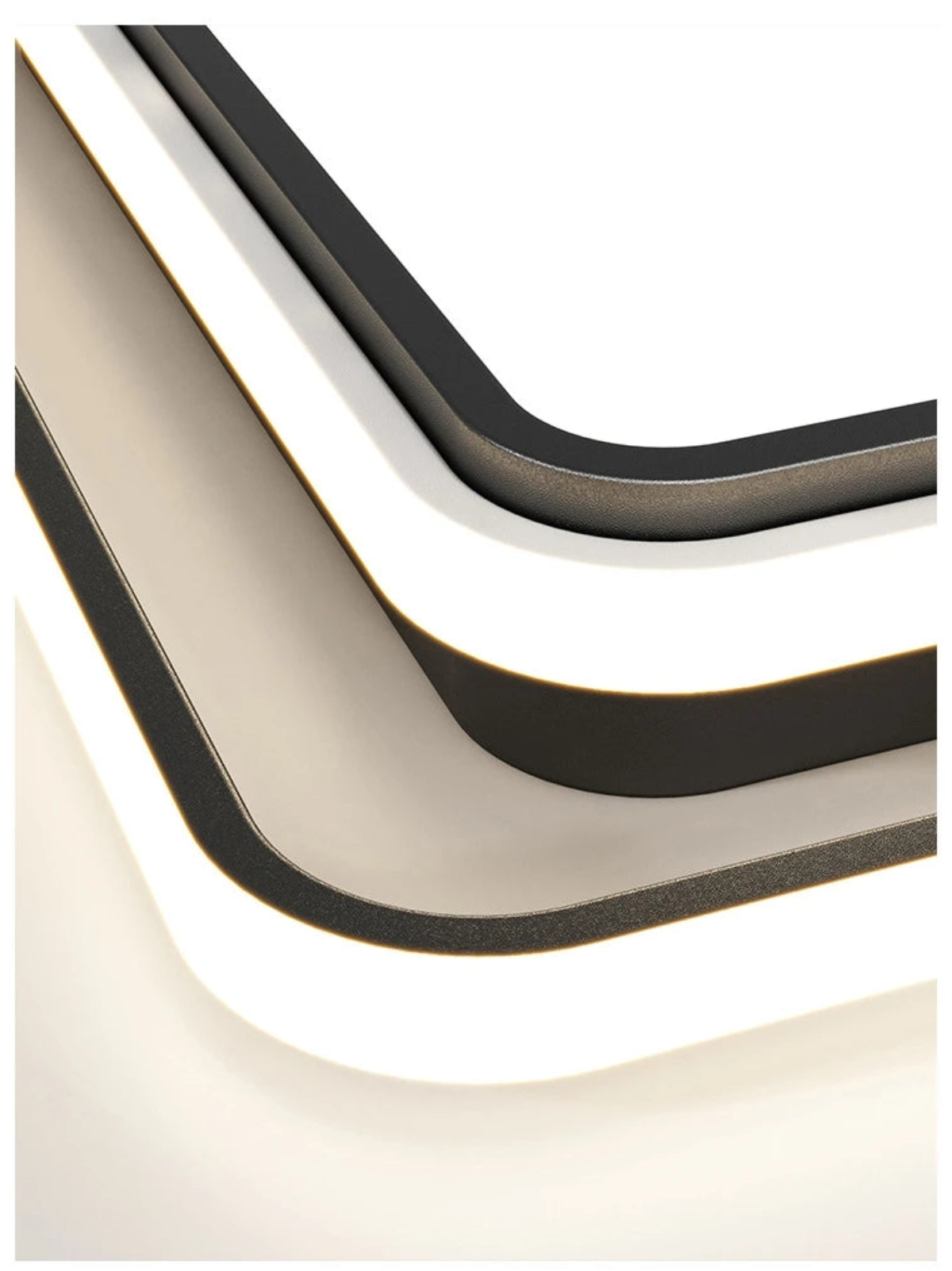 Extreme close-up macro detail of the Halo LED flush mount ceiling light showing layered matte black and white acrylic ring construction with soft LED glow — LivDecor
