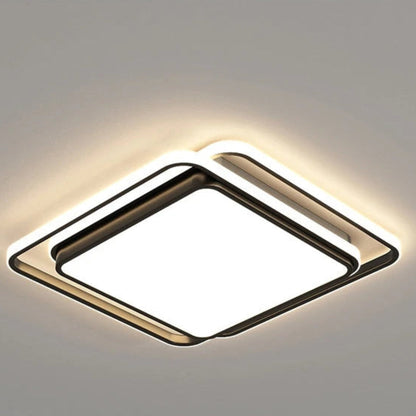 Halo modern tricolor LED flush mount ceiling light in matte black square frame switched on showing warm amber halo glow on a grey ceiling — LivDecor
