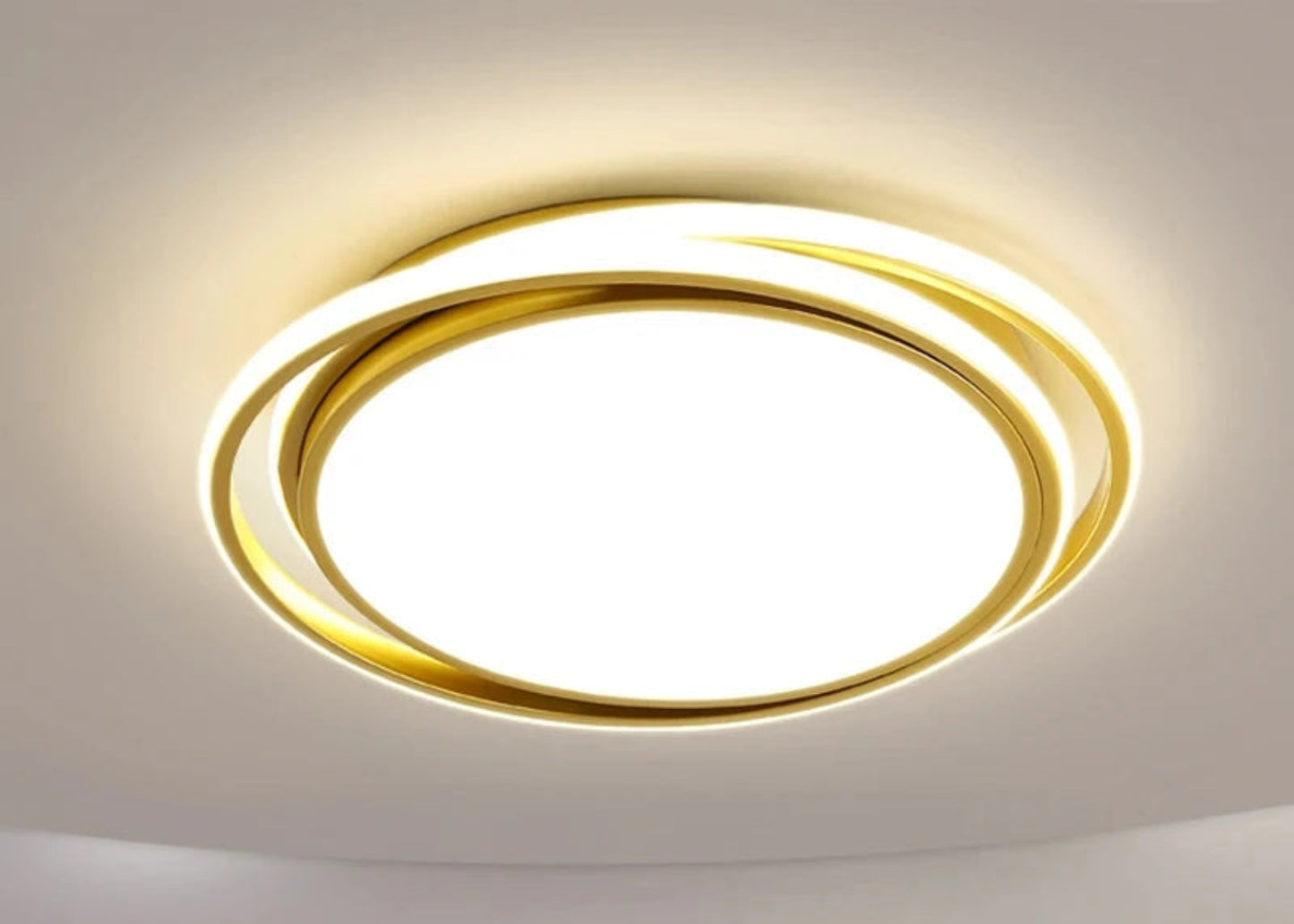 Halo modern tricolor LED flush mount ceiling light in golden round double-ring frame glowing warm white on a white ceiling — LivDecor
