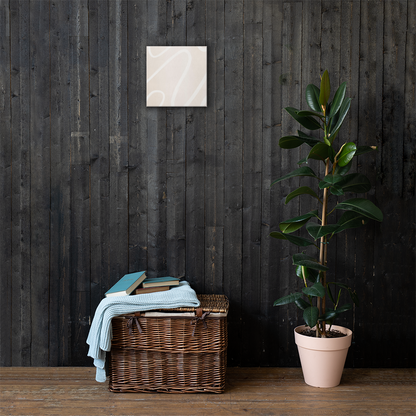 Ivory Flow abstract canvas print in 12×12 square hung on a dark charcoal wood plank wall above a wicker basket with a light blue knit throw and rubber tree plant — LivDecor
