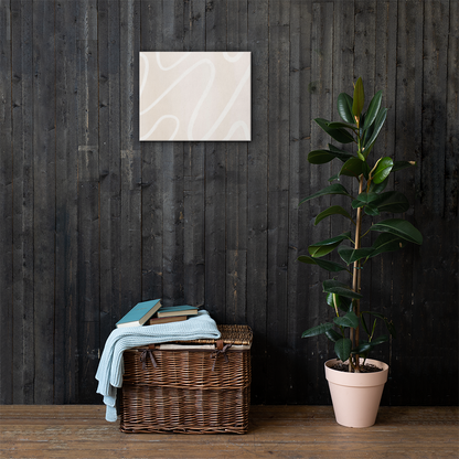 Ivory Flow abstract canvas print in 16×20 hung on a dark charcoal wood plank wall above a wicker basket with a light blue knit throw and rubber tree plant — LivDecor
