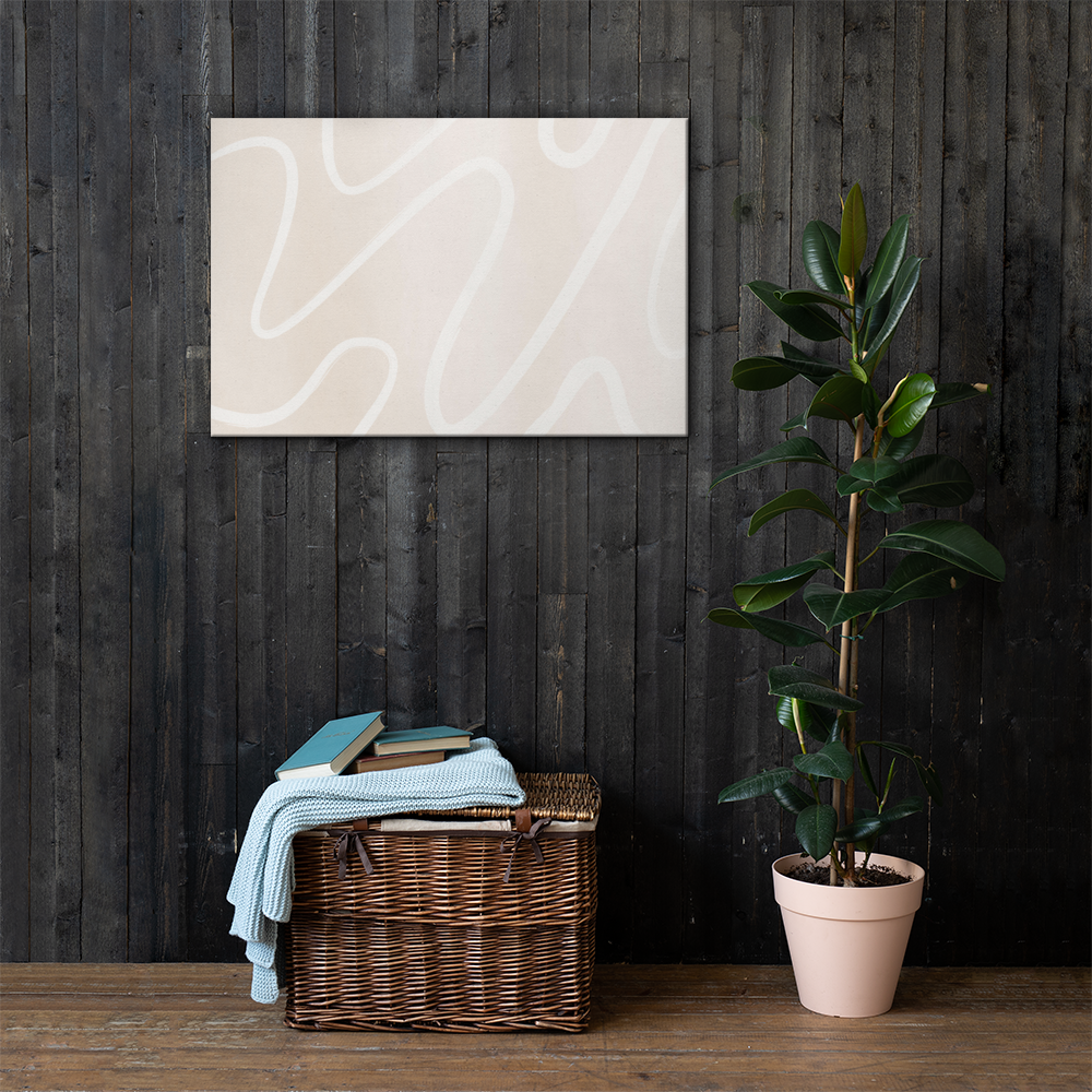 Ivory Flow abstract canvas print in 24×36 hung large on a dark charcoal wood plank wall above a wicker basket with a light blue knit throw and rubber tree plant — LivDecor
