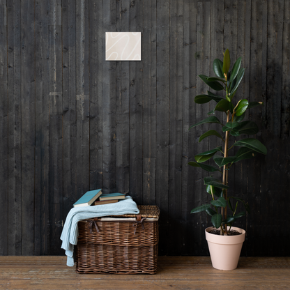 Ivory Flow abstract canvas print in 8×10 hung on a dark charcoal wood plank wall above a wicker basket with a light blue knit throw and rubber tree plant — LivDecor
