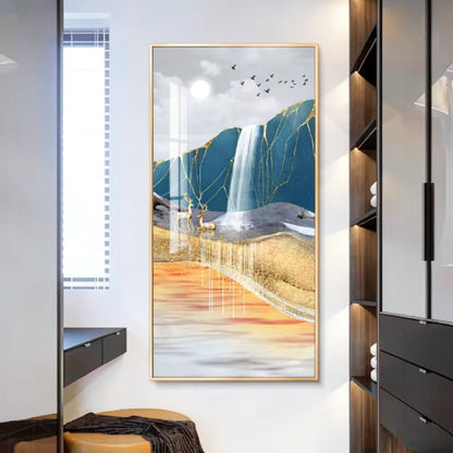 Gold-framed vertical mural of an abstract landscape with teal mountains, a waterfall, gold-leaf accents, a golden deer and birds in flight, mounted in a modern entryway — LivDecor
