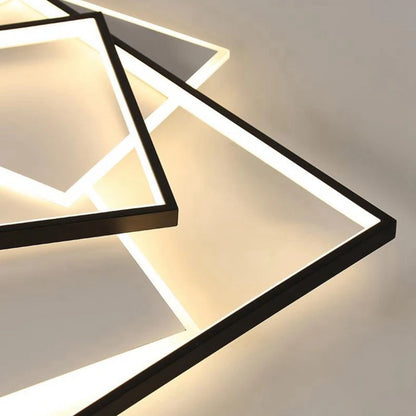 Close-up detail of a modern geometric LED flush mount ceiling light showing black layered rectangle frames with warm white LED glow — LivDecor
