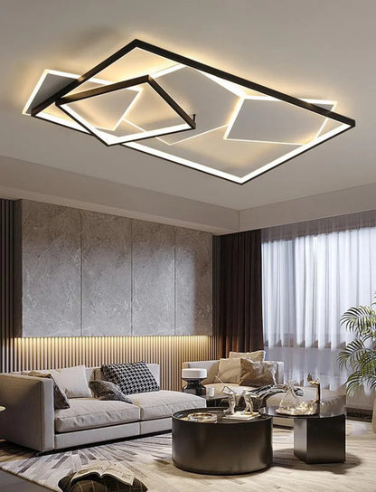 Modern geometric LED flush mount ceiling light with black multi-rectangle layered frame and warm white glow in a luxury living room lifestyle setting — LivDecor
