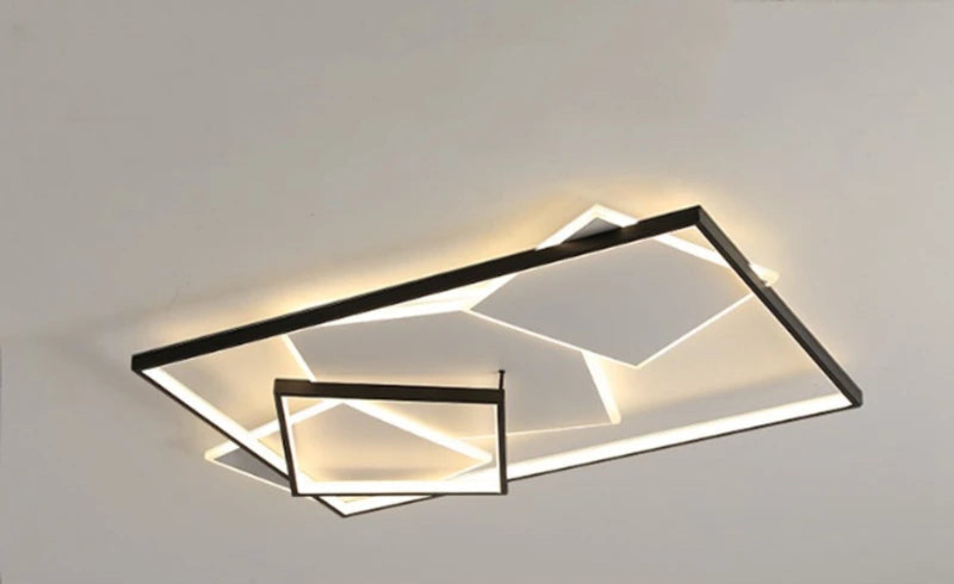 Modern geometric LED flush mount ceiling light with black multi-rectangle layered frame and warm white glow on a white background — LivDecor
