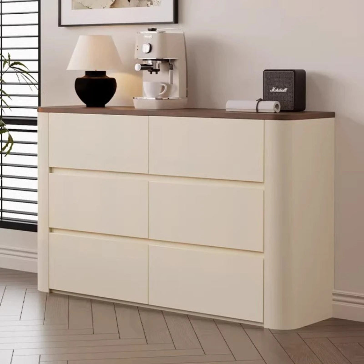 Nordic Elegance cream ivory buffet credenza with walnut top shot from the left side with natural window light and blinds in background styled with a table lamp, espresso machine, and Marshall speaker — LivDecor
