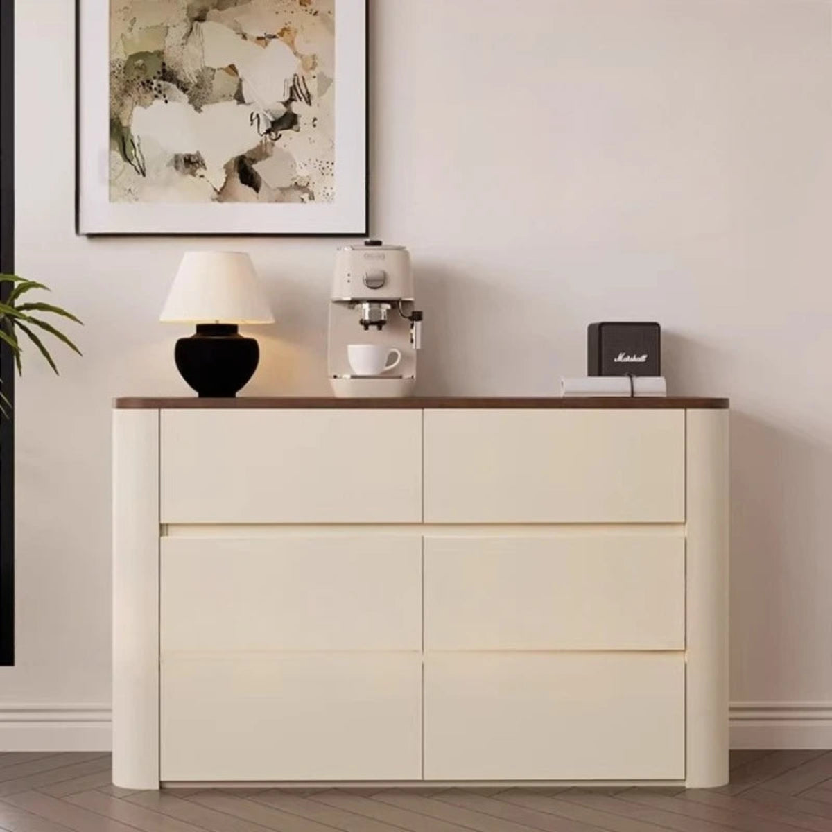 Nordic Elegance cream ivory buffet credenza with walnut top shot from a right angle showing the 1 top and 2 bottom drawer layout styled with a table lamp, espresso machine, and Marshall speaker — LivDecor
