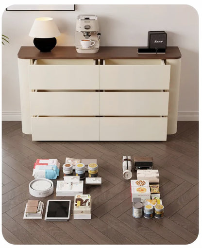 Nordic Elegance cream six-drawer credenza with drawers open beside an array of household items on the floor demonstrating its storage capacity — LivDecor
