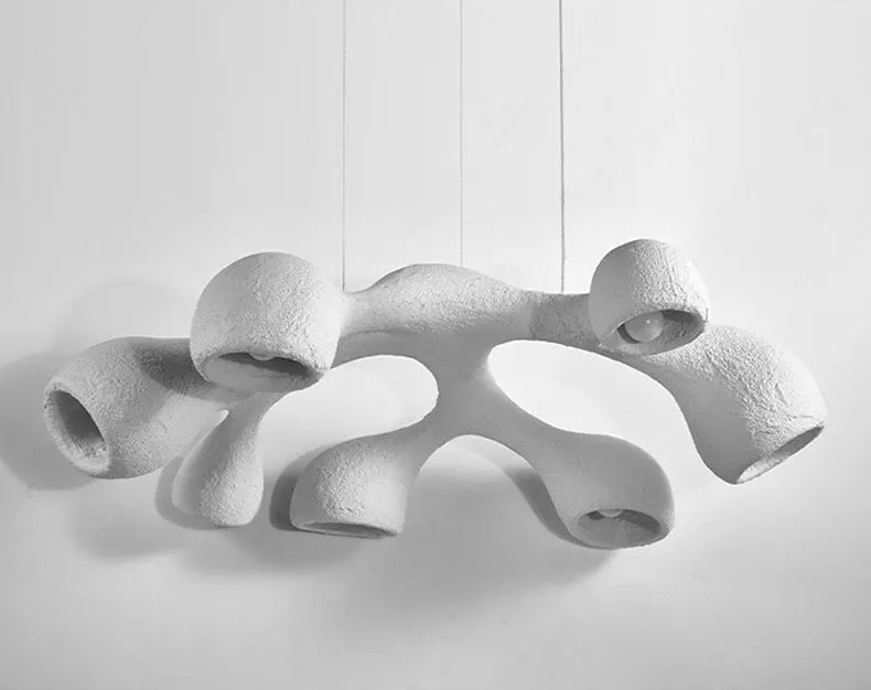 Odense Cocoon sculptural cloud pendant chandelier in white 7-head flat configuration shown in black and white revealing dramatic wide cloud-like sculptural form on a neutral background — LivDecor
