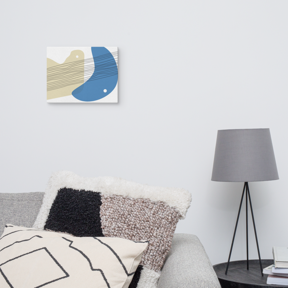 Sand & Sea abstract canvas print in 11×14 hung above a grey sofa with textured mixed cushions beside a black tripod floor lamp in a Scandinavian-style living room — LivDecor
