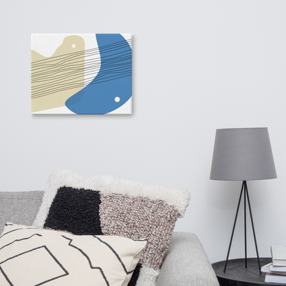 Sand & Sea abstract canvas print in 16×20 hung above a grey sofa with textured mixed cushions beside a black tripod floor lamp in a Scandinavian-style living room — LivDecor
