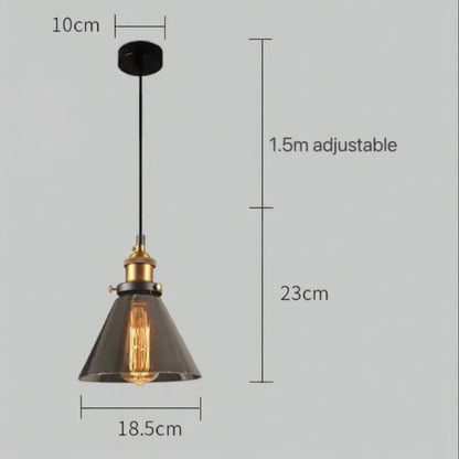 Smoky grey glass cone-shaped pendant light with brass Edison fitting and black cord, showing 18.5cm width and 23cm drop with 1.5m adjustable cord on a grey background — LivDecor
